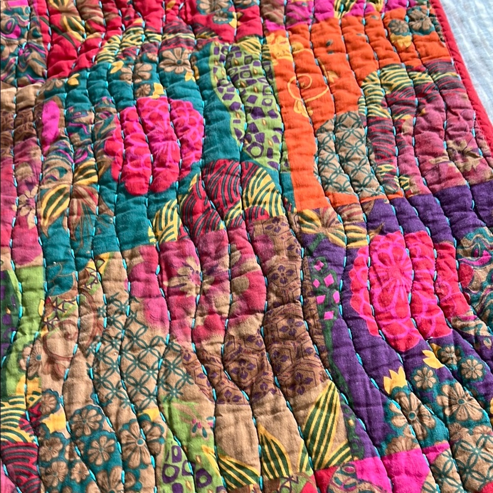 Vibrant Red and Pink Quilted Bedding with Geometric Design